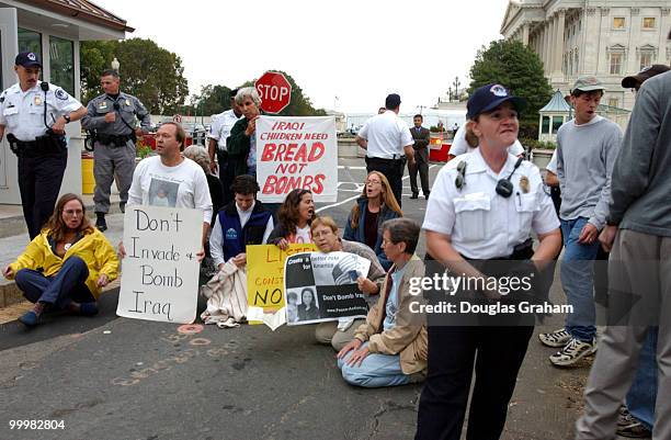 Anti-war protesters stage a sit-in, at the U.S. Capitol. They were later arrested by U.S. Capitol Police for civil disobedience.