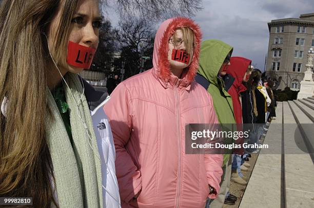 Protesters with the "Bound 4 Life" group have been protesting for 16 months day and night. They stand in front of the Supreme Court building with red...