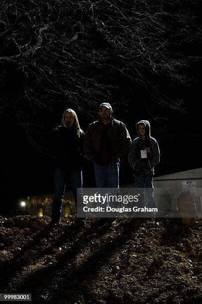 Karen Bennett, Greg Gilley and eight-year-old Beaux Gilley from Greenville, TN. Watches the State Funeral of President Gerald R. Ford. Gilley was...