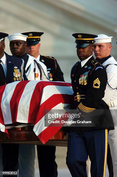 The 3rd Infantry Division Old Guard transfers former President Ronald Reagan's casket from the horse-drawn caisson to take him to to lie in state in...