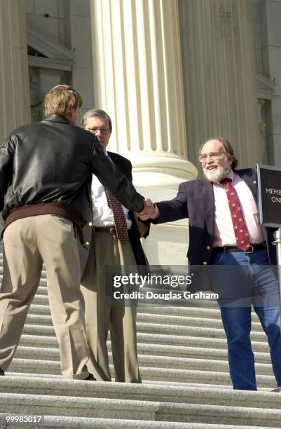 Neil Abercrombie, D-Hawaii, and Gene Taylor, D-Miss., say god bye after the last vote before recess.