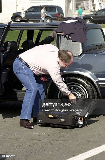 Neil Abercrombie, D-Hawaii, packs some things for the trip home in the parking lot of the House Chamber after the last vote before recess.