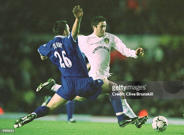 Robbie Keane of Leeds gets past John Terry of Chelsea during the match between Leeds United and Chelsea in the Worthington Cup Fourth Round at Elland...