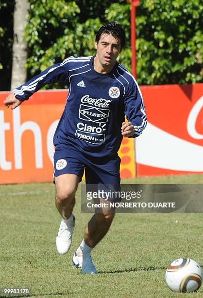 Paraguay's football team player Julio Cesar Caceres takes part in a practice ahead of his participation in the FIFA WC South Africa 2010, in Luque,...