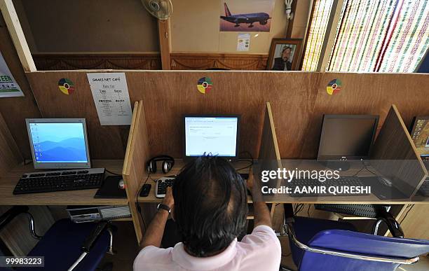 Pakistani computer user tries to open the Facebook website at an internet cafe in Islamabad on May 19 against the published caricatures of Prophet...