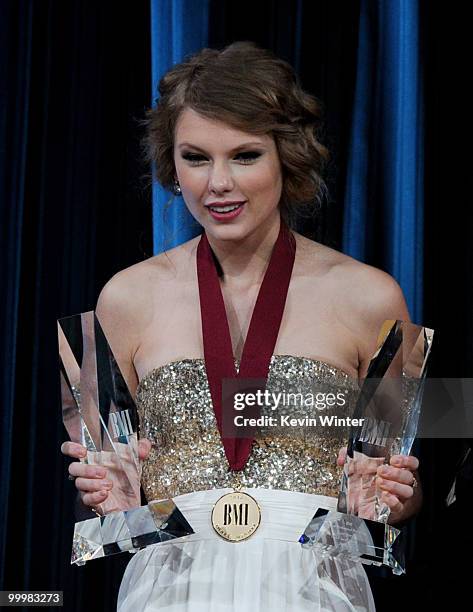 Singer/songwriter Taylor Swift accepts Pop Song of the Year awards at the 58th Annual BMI Pop Awards at the Beverly Wilshire Hotel on May 18, 2010 in...