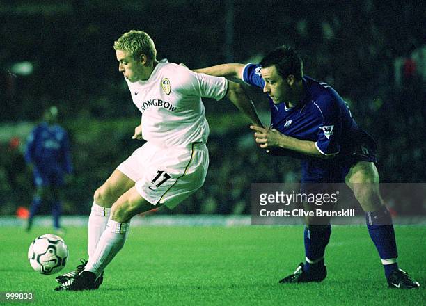 Alan Smith of Leeds holds off John Terry of Chelsea during the match between Leeds United and Chelsea in the Worthington Cup Fourth Round at Elland...