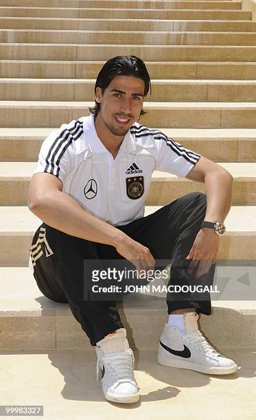 Germany's midfielder Sami Khedira poses for photographers after speaking to journalists during a so-called media day at the Verdura Golf and Spa...