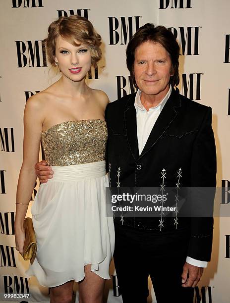 Singer/songwriters Taylor Swift and John Fogerty arrive at the 58th Annual BMI Pop Awards at the Beverly Wilshire Hotel on May 18, 2010 in Beverly...