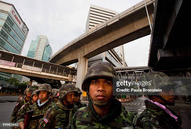 Thai soldiers get ready at sunrise for the early morning attack on the red shirt camp May 19, 2010 in Bangkok, Thailand. At least 5 people are...
