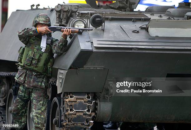 Thai soldiers start the early morning attack on the red shirt camp May 19, 2010 in Bangkok, Thailand. At least 5 people are reported to have died as...