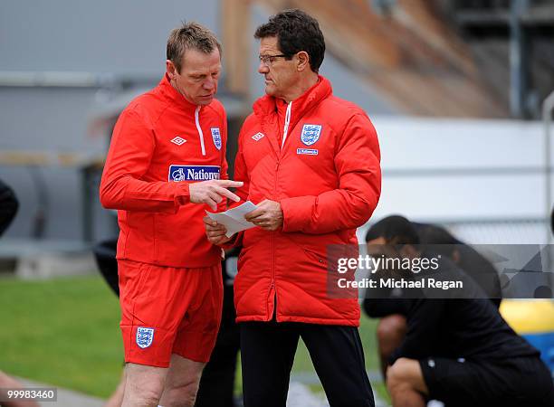 Assistant manager Stuart Pearce talks to manager Fabio Capello during an England training session on May 19, 2010 in Irdning, Austria.