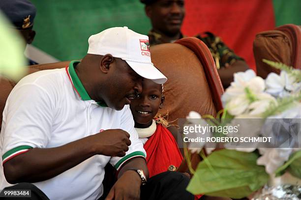 Burundi-vote-Nkurunziza,INTERVIEW" --- Jonathan Nkurunziza , the son of Burundian President Pierre Nkurunziza , listens to his father during a...