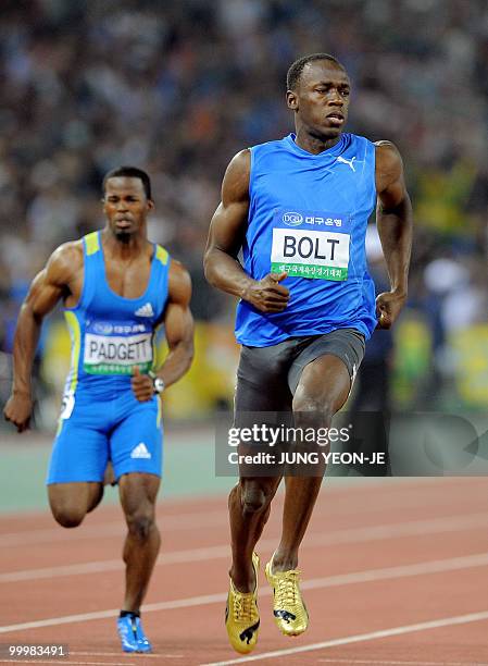 World and Olympic triple gold medallist Usain Bolt from Jamaica crosses the finish line ahead of Travis Padgett from the US during the men's 100...