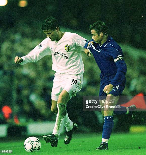 Eirik Bakke of Leeds holds off Graeme Le Saux of Chelsea during the match between Leeds United and Chelsea in the Worthington Cup Fourth Round at...