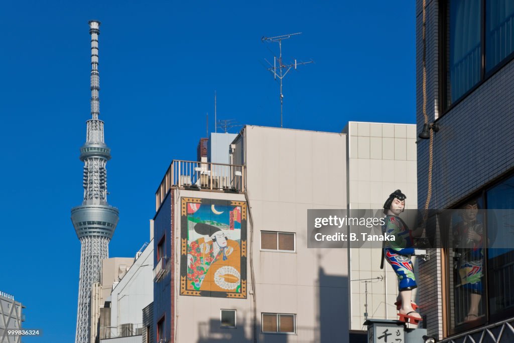 Edo Period Figure and Tokyo Skytree in the Old Downtown Asakusa District of Tokyo, Japan