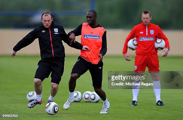 Ledley King tackles Wayne Rooney during an England training session on May 19, 2010 in Irdning, Austria.