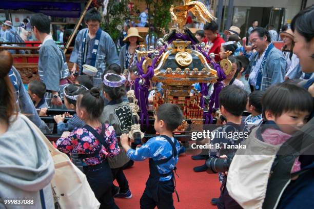 children's mikoshi portable shrine at sanja festival in the downtown asakusa district of tokyo, japan - mikoshi stock pictures, royalty-free photos & images