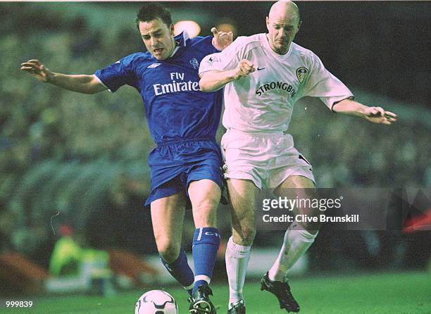 Danny Mills of Leeds holds off John Terry of Chelsea during the match between Leeds United and Chelsea in the Worthington Cup Fourth Round at Elland...