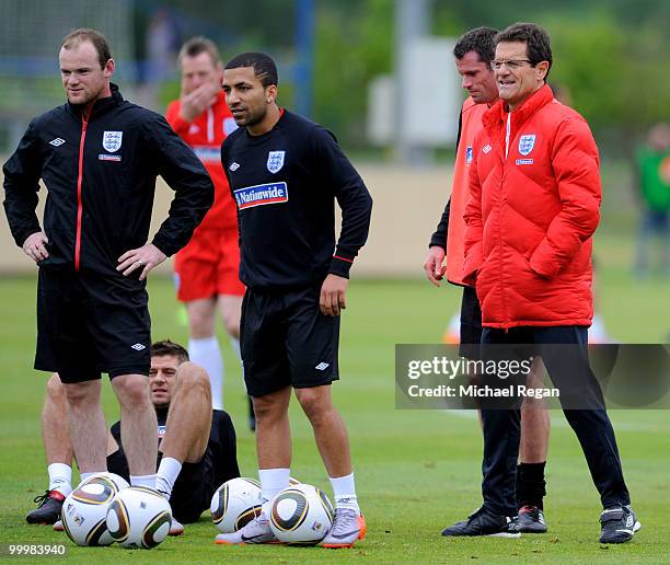 Wayne Rooney, Aaron Lennon and Fabio Capello look on during an England training session on May 19, 2010 in Irdning, Austria.