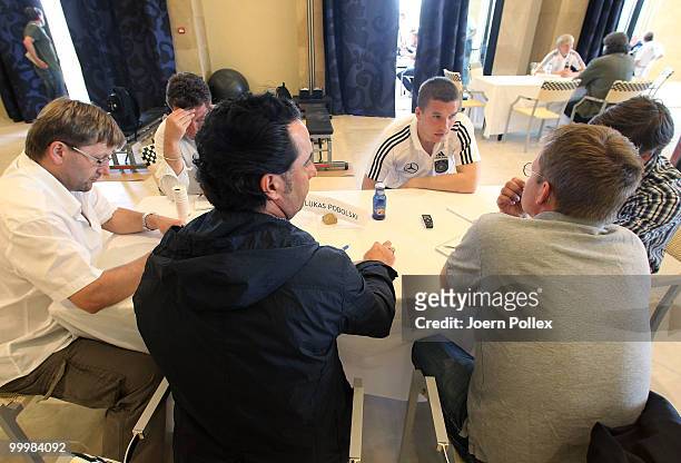 Lukas Podolski of Germany talks to the media during a press conference at Verdura Golf and Spa Resort on May 19, 2010 in Sciacca, Italy.