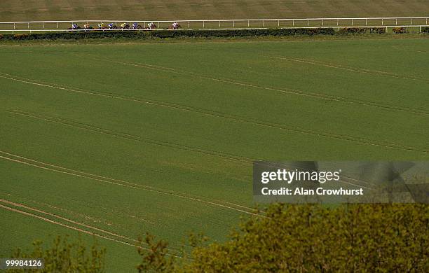 General view of the runners and riders as Snow Fairy and Eddie Ahern sit in second last place before going on to win The Blue Square Height Of...