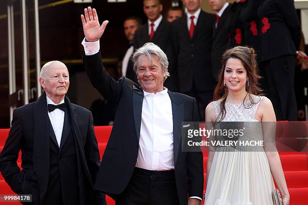 French actor Alain Delon stands next to the president of the festival Gilles Jacob as he arrives with his daughter Anoushka for the screening of "Il...