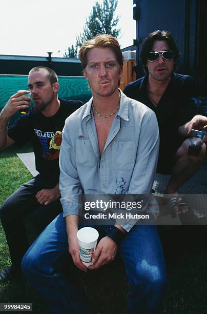 Queens of The Stone Age posed back stage at Reading Festival, Reading on August 26 2000 L-R Nick Oliveri, Josh Homme, Gene Trautmann