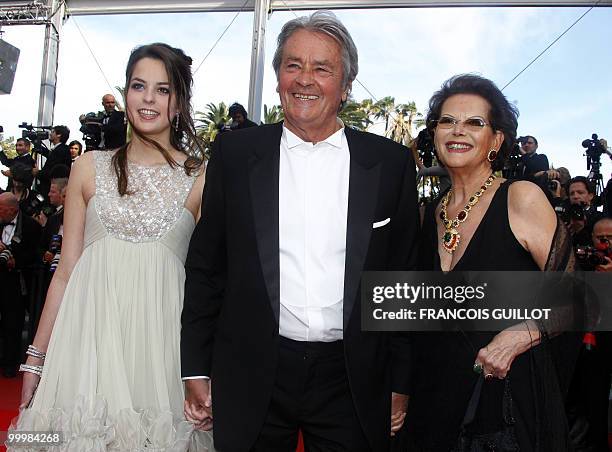 Italian actress Claudia Cardinale , French actor Alain Delon and his daughter Anoushka arrive for the screening of "Il Gattopardpo" presented during...