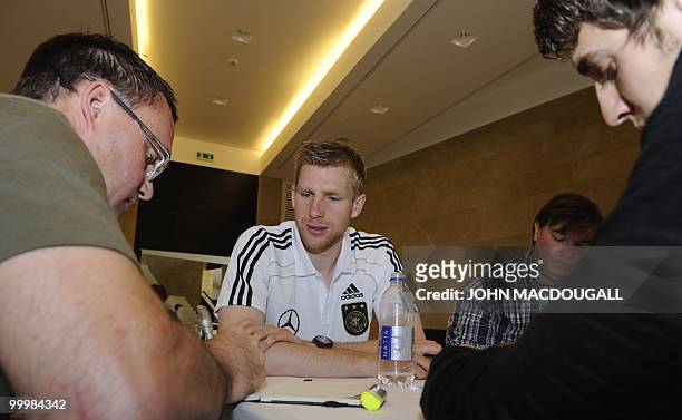 Germany's defender Per Mertesacker speaks to journalists during a so-called media day at the Verdura Golf and Spa resort, near Sciacca May 19, 2010....