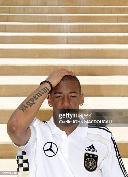 Germany's defender Jerome Boateng speaks to a journalist during a so-called media day at the Verdura Golf and Spa resort, near Sciacca May 19, 2010....