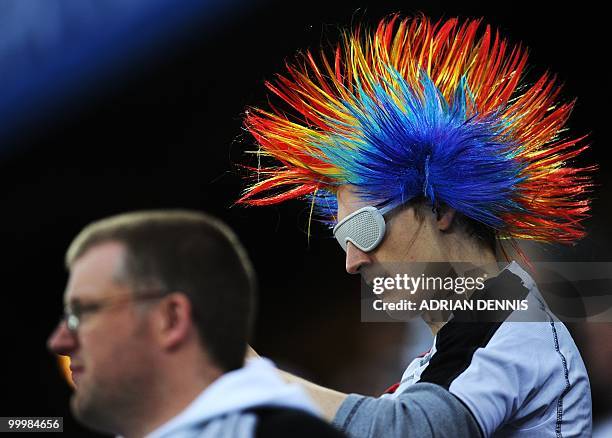 Supporters of Fulham cheer ahead of the final football match of the UEFA Europa League Fulham FC vs Aletico Madrid in Hamburg, northern Germany on...