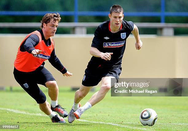 Scott Parker takes on James Milner during an England training session on May 19, 2010 in Irdning, Austria.