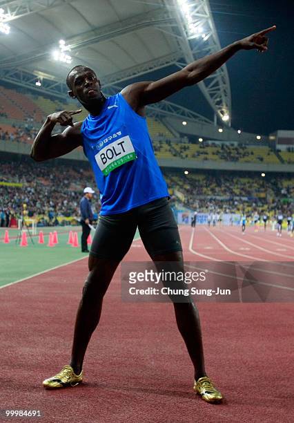 Usain Bolt of Jamaica celebrates after winning the men's 100 metre race during the Colorful Daegu Pre-Championships Meeting 2010 at Daegu Stadium on...
