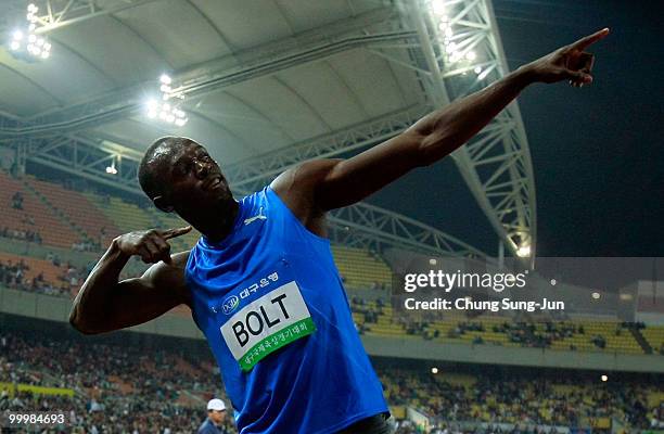 Usain Bolt of Jamaica celebrates after winning the men's 100 metre race during the Colorful Daegu Pre-Championships Meeting 2010 at Daegu Stadium on...