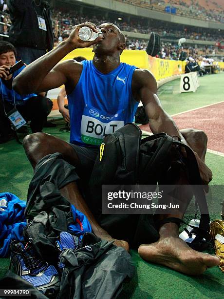 Usain Bolt of Jamaica rests after winning the men's 100 metre race during the Colorful Daegu Pre-Championships Meeting 2010 at Daegu Stadium on May...