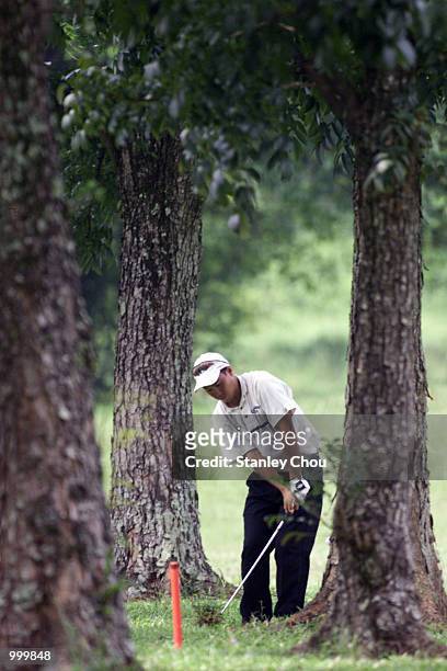 Lam Chih-Bing of Singapore in action from the rough during the Second Round of the Foursome Stroke Play during the Davidoff Nations Cup- World Cup...