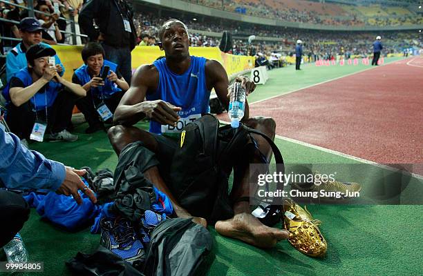 Usain Bolt of Jamaica rests after winning the men's 100 metre race during the Colorful Daegu Pre-Championships Meeting 2010 at Daegu Stadium on May...