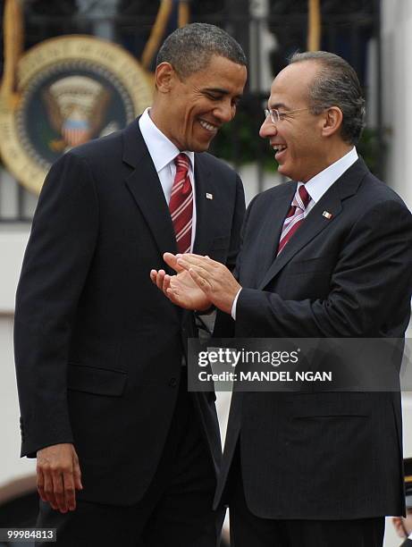 Mexico�s President Felipe Calderón applauds US President Barack Obama May 19, 2010 during a welcome ceremony on the South Lawn of the White House to...