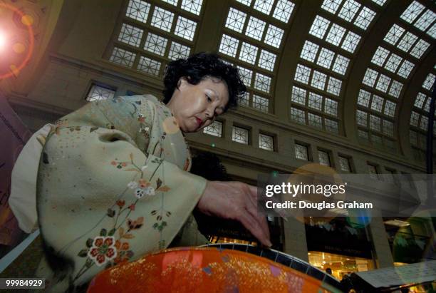 Sachilco Smith a member of the Washington Toho Koto Society plays Japanese koto music at Union Station. The Station was host to the National Cherry...