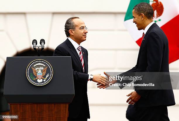 President Barack Obama welcomes Mexican President Felipe Calderon for an official state visit during a ceremony on the South Lawn of the White House...