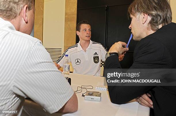 Germany's defender Marcell Jansen speaks to journalists during a so-called media day at the Verdura Golf and Spa resort, near Sciacca May 19, 2010....