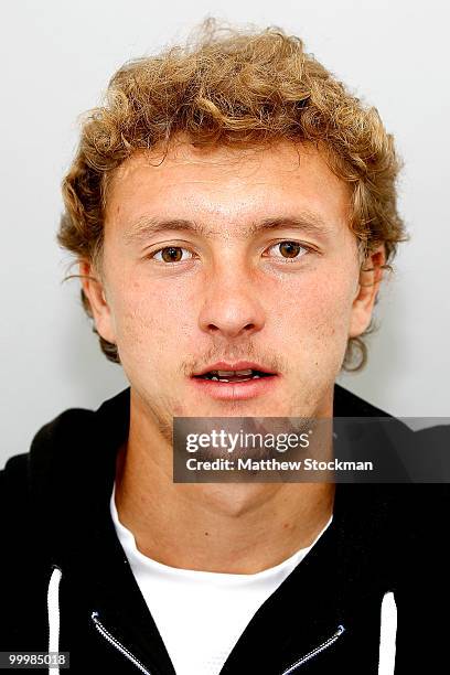 Player Denis Istomin poses for a headshot at Roland Garros on May 19, 2010 in Paris, France.