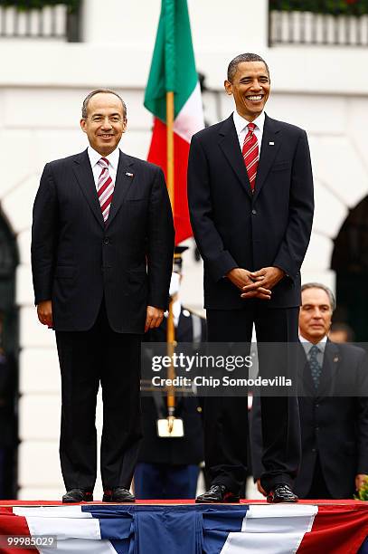 President Barack Obama welcomes Mexican President Felipe Calderon for an official state visit during a ceremony on the South Lawn of the White House...