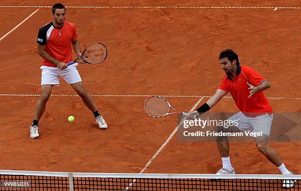Viktor Troicki and Nenad Zimonjic of Serbia in action during their double match against Jeremy Chardy and Nicolas Mahut of France during day four of...