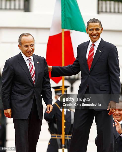 President Barack Obama welcomes Mexican President Felipe Calderon for an official state visit during a ceremony on the South Lawn of the White House...