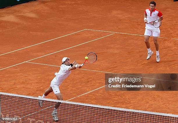 Jeremy Chardy and Nicolas Mahut of France in action during their double match against Viktor Troicki and Nenad Zimonjic of Serbia during day four of...