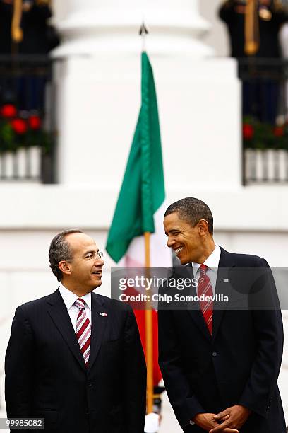 President Barack Obama welcomes Mexican President Felipe Calderon for an official state visit during a ceremony on the South Lawn of the White House...