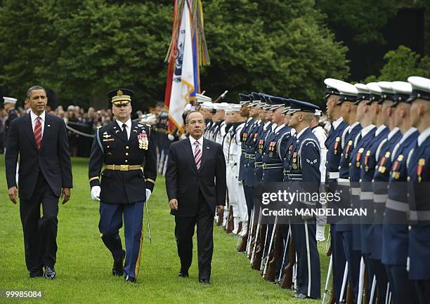 President Barack Obama and Mexico�s President Felipe Calderón inspect an honour guard May 19, 2010 during a welcome ceremony on the South Lawn of the...