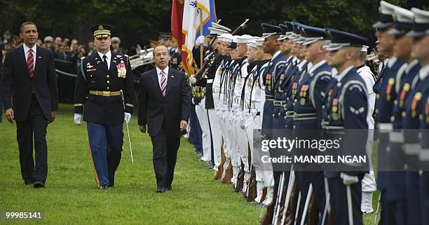 President Barack Obama and Mexico�s President Felipe Calderón inspect an honor guard May 19, 2010 during a welcome ceremony on the South Lawn of the...